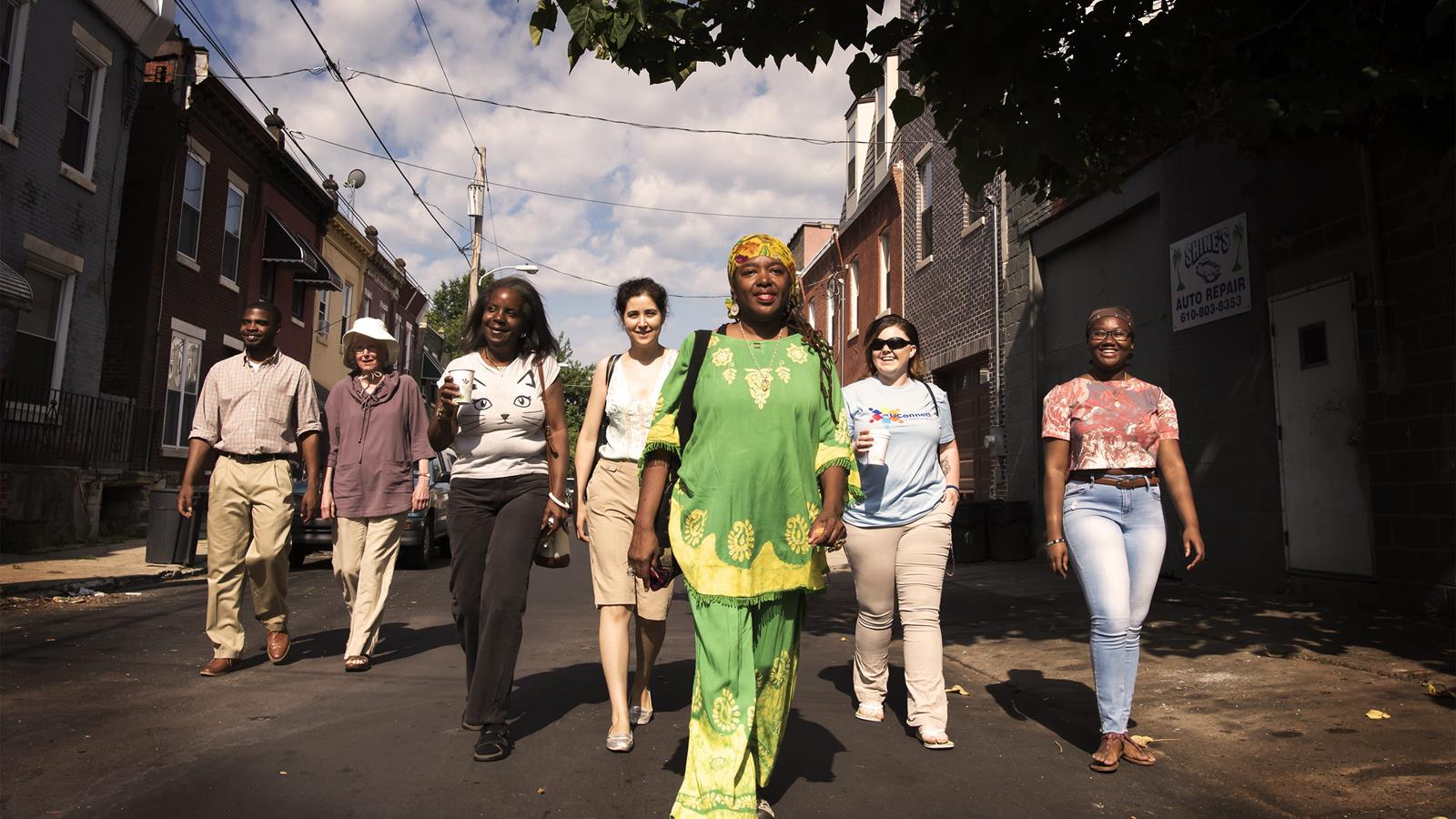 drexel and community side-by-side students walk down a street together