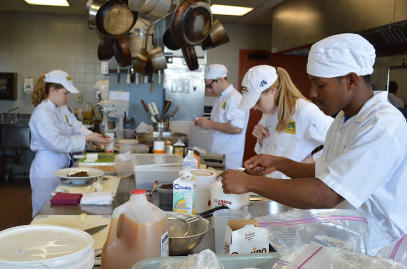 Students transform bruised and misshapen fruits and vegetables into cobblers, shakes and other products in the Drexel Food Lab.