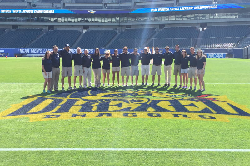 The Drexel Athletic Department team on field at the NCAA Men's Lacrosse Final Four, hosted by Drexel. Courtesy of the Drexel Athletic Department.