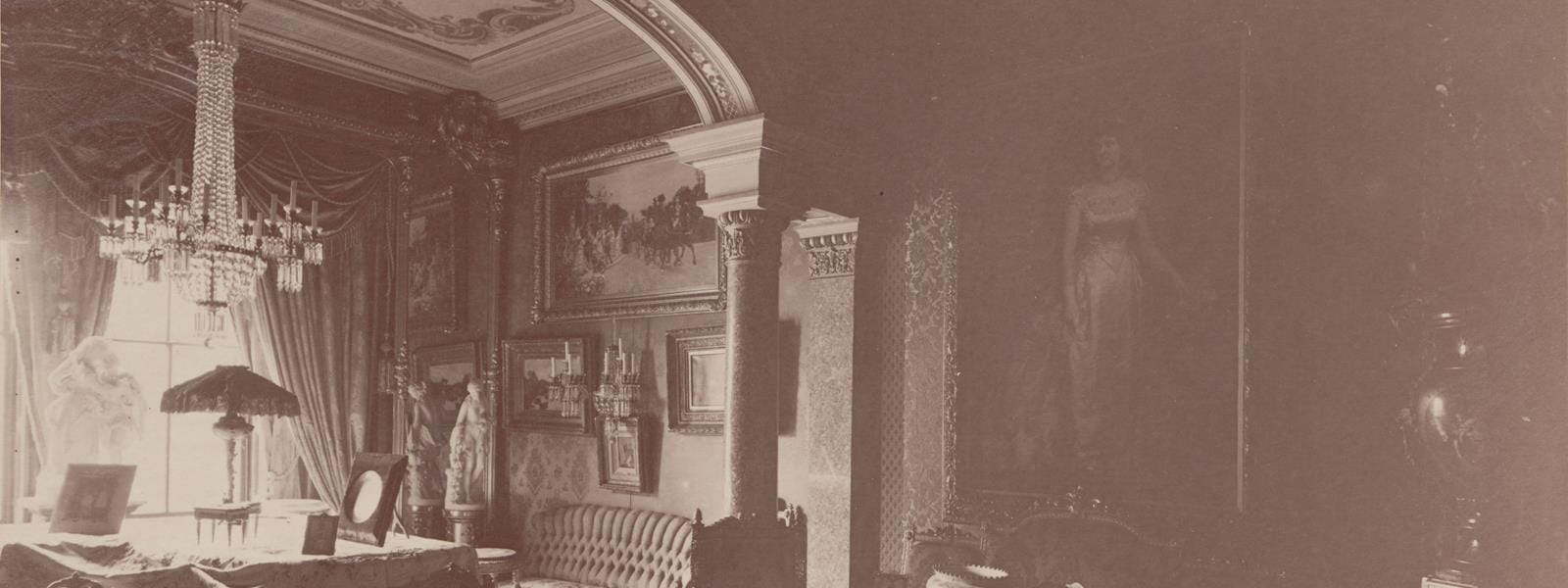 The reception room at Anthony’s house, which shows “After the Wedding” hanging above the other paintings above the couch in the far corner of the room. This is one of the undated photographs from the Drexel family photo book that Mayes researched and included in the exhibition. Photo courtesy Drexel University Archives.