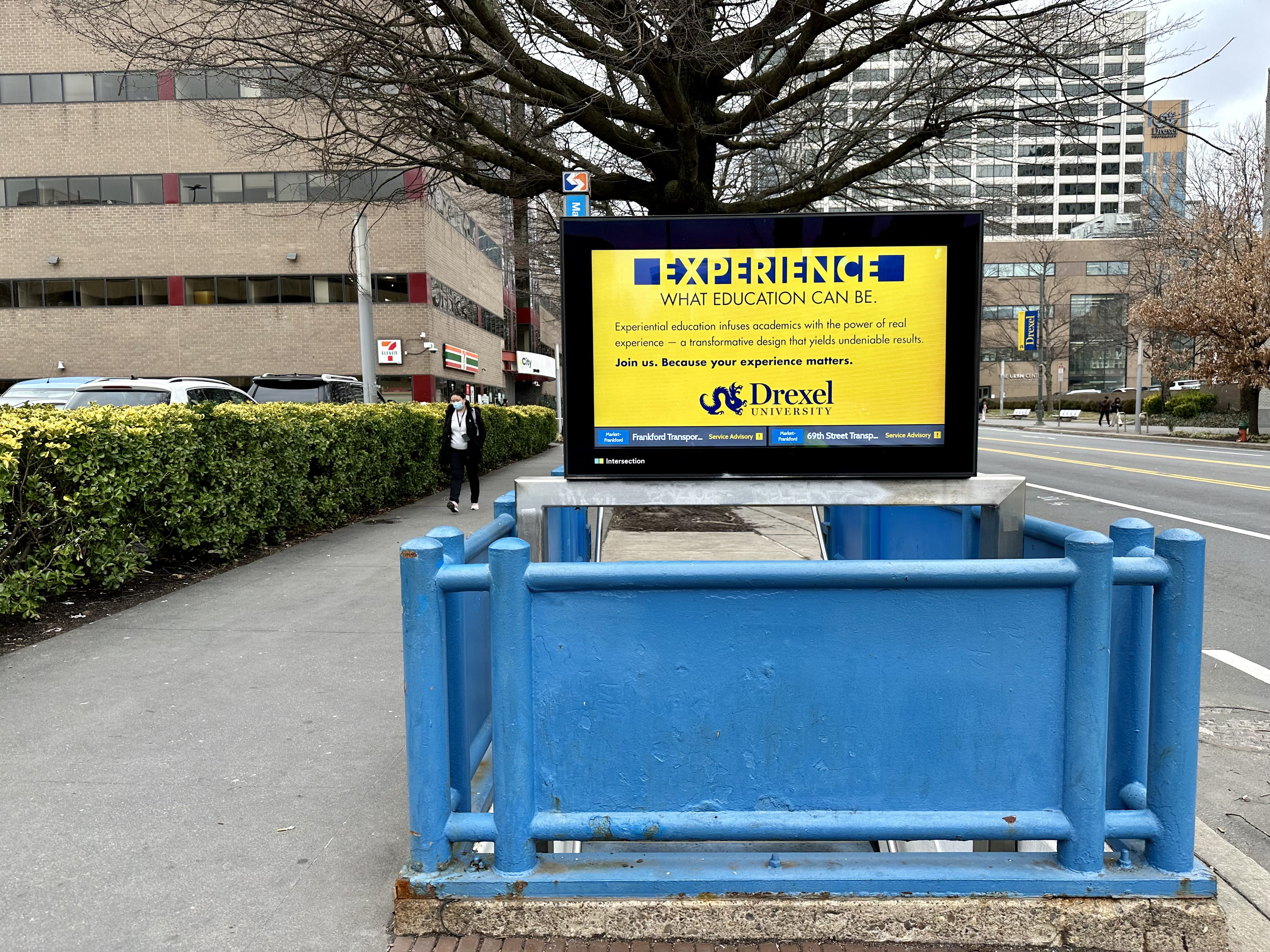 Drexel Experience Education ad on a SEPTA subway station entrance