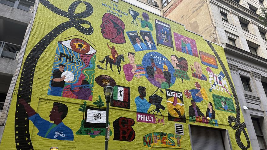 Yellow mural on a side of a building