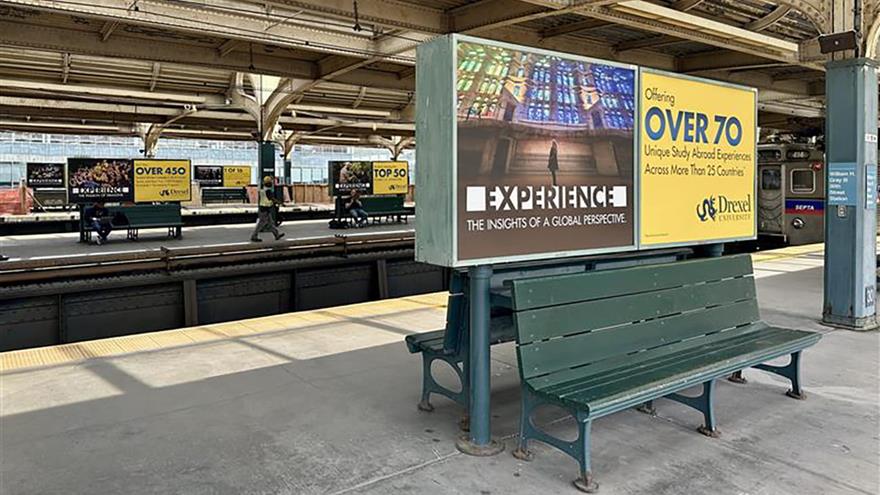 Drexel advertisements above benches in 30th Street Station.