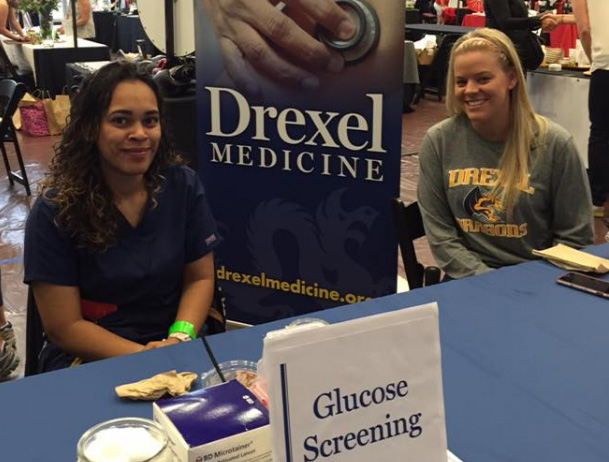 Drexel Medicine staff providing free medical screenings at the annual Philly BeWell Boot Camp event.
