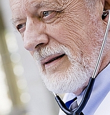 Older male physician.