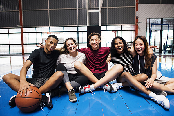 A group of students gathered in a recreational facility.