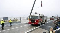 Reopening of I-95 with fire truck and U.S. flag