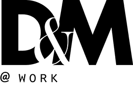 design and merchandising at work logo in black text with white background